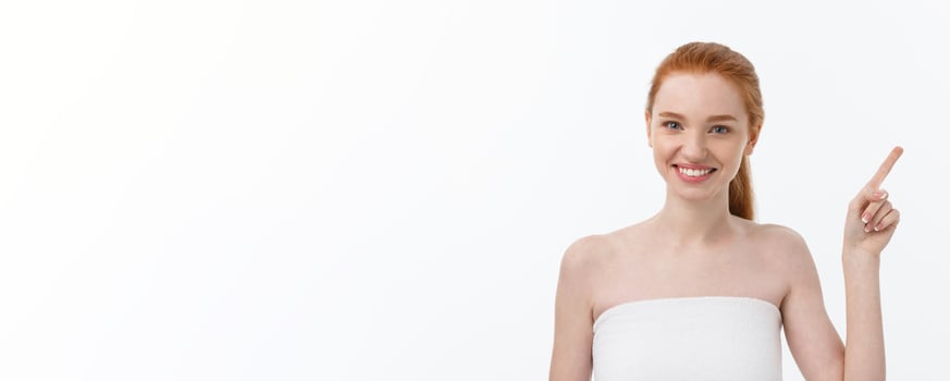 Beauty Skin care portrait of young woman showing copy space by hand. photo