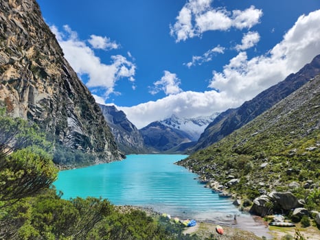 The turquoise water of the lake in the mountains photo