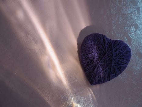 Yarn hearts and reflections on plastic for a minimalist copy space. photo