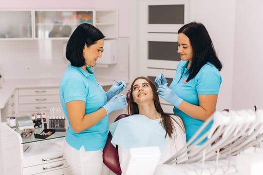 The girl has a visit to the dentist for a dental examination. photo