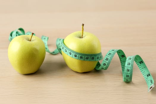 Two Green Apple and Measuring Tape photo