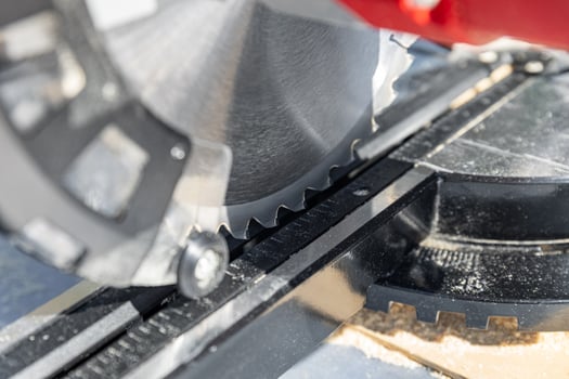 Miter saw, construction tool ,carpentry home renovation backgrounds, copy space image. Miter saw with a protective screen. Safe equipment for the furniture and construction industry. Close-up. photo