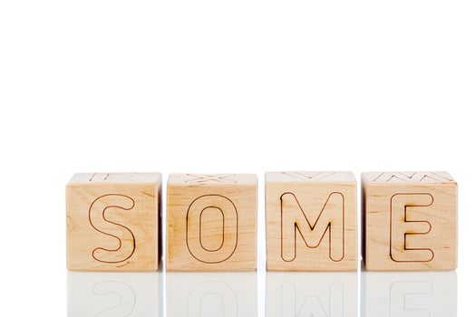 Wooden cubes with letters some on a white background photo