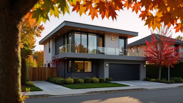 Vibrant autumn foliage accentuates modern suburban home on sundrenched street photo