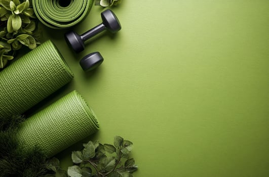 Fitness equipment on a green mat in a home workout setting during the day photo