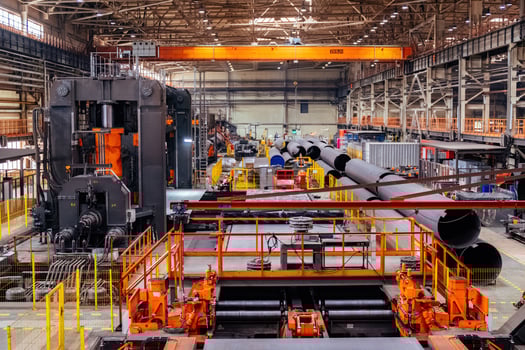 Pipe factory production line. Tube formation by roll sheet bending machine photo