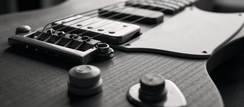 Blackandwhite closeup portrait of a classic vintage electric guitar with ample negative space photo