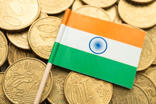 India flag on gold coins, finance and banking business. photo