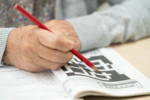 Bangkok, Thailand June 1, 2024 Alzheimer disease AD, Asian elderly woman playing sudoku puzzle game to practice for dementia prevention. photo