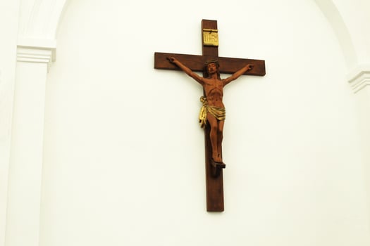 Cross with Crucifix in the church temple. Religious symbols made of wood cross crucifix photo