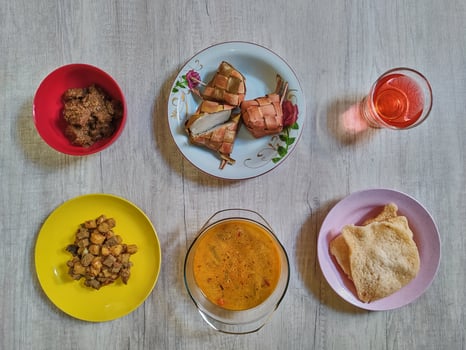 Variety of delicious Indonesian typical home cooked dishes served on the table on Eid al-Fitr from high angle view photo