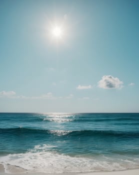 The ocean is blue and the sun is shining brightly. photo