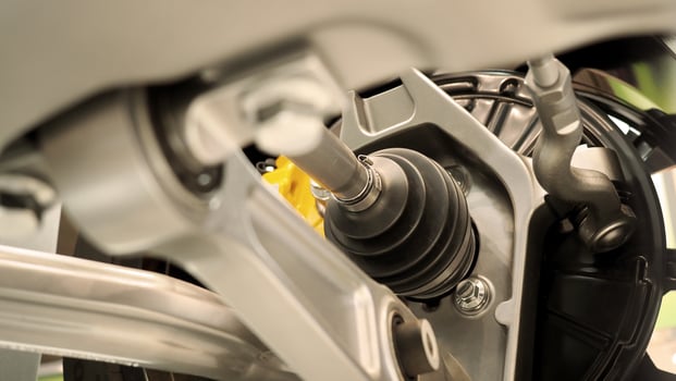 Car suspension and drive shaft. Structure of EV car spare parts. Such as Front or Rear suspension Shock absorber suspension Brake. Elements of the suspension and Chassis structure. Car service repair. photo