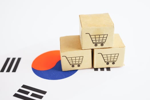 Online shopping, Shopping cart box on South Korea flag, import export, finance commerce. photo
