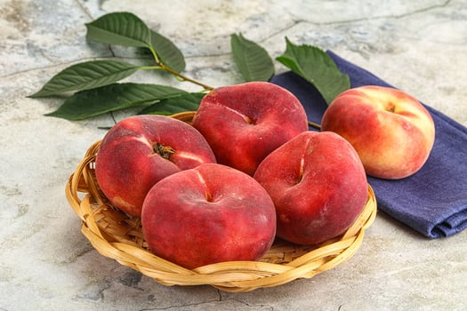 Ripe sweet and juicy Flat peach photo
