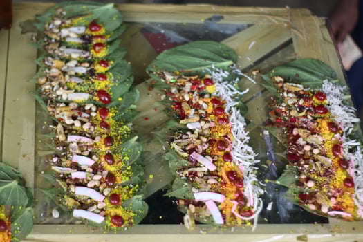 Banarasi paan or betel leaf garnished with betel nut and all indian colorful banarasi ingredients for sale at pous fair,santiniketan photo