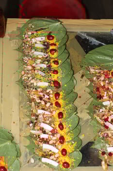 Banarasi paan or betel leaf garnished with betel nut and all indian colorful banarasi ingredients for sale at pous fair,santiniketan photo