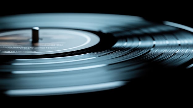 A spinning vinyl record emits soft melodies under warm, ambient lighting photo