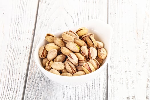 Salted tasty pistachio nuts heap photo