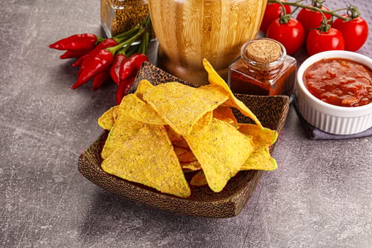 Mexican corn nachos chips with salsa photo