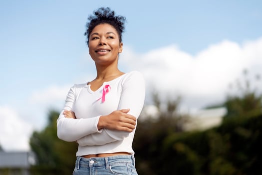 Young woman smiling and supporting breast cancer awareness photo