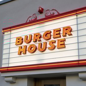 Modern burger house logo on colorchangeable marquee sign against white background Realistic Simple photo