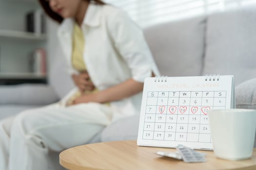 stomach ache. Asian women have abdominal pain, indigestion, gastritis, menstrual cramps, flatulence, diarrhea, distention, colon cancer, belly inflammation problem, suffer food poisoning, abdomen photo