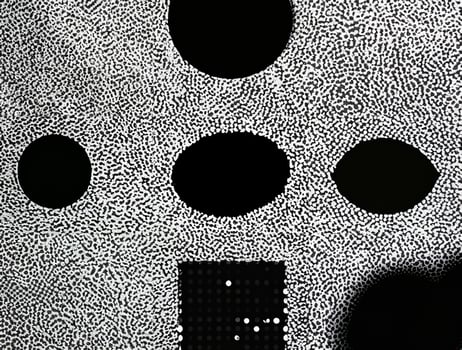 Abstract black and white dotted texture forming a random yet organized pattern with intricate details. photo