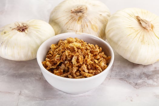 Dried roasted onion flakes for culinary photo
