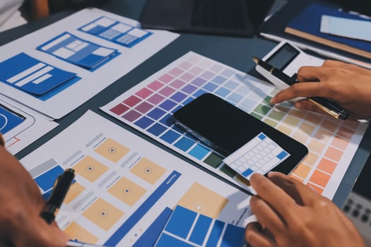 The designer team is designing the uxui system to make the uxui system work well on new phones and support system updates. Website development concept UI UX front end designer photo
