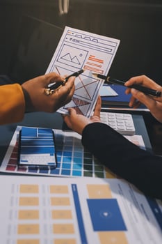 The designer team is designing the uxui system to make the uxui system work well on new phones and support system updates. Website development concept UI UX front end designer photo