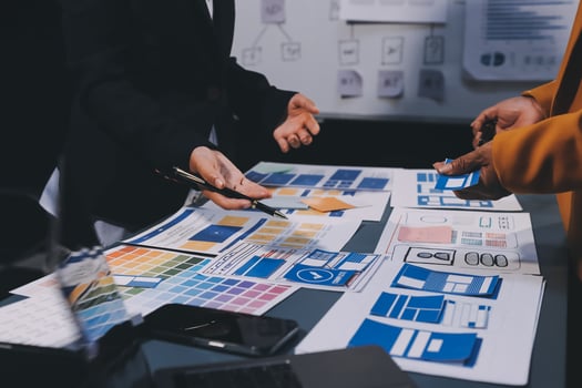 The designer team is designing the uxui system to make the uxui system work well on new phones and support system updates. Website development concept UI UX front end designer photo