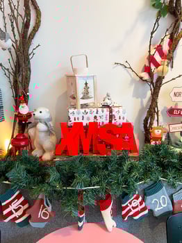 Bauble toy and Christmas socks for gifts hanging on wall. Christmas holidays and Santa Claus concept photo