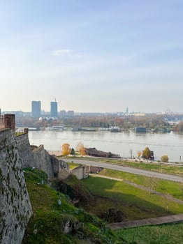 Looking across the Sava river in Belgrade, river boats in the foreground and a variety of office blocks in the distance. Belgrade in autumn season photo