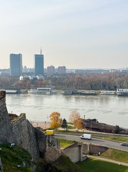 Looking across the Sava river in Belgrade, river boats in the foreground and a variety of office blocks in the distance. Belgrade in autumn season photo