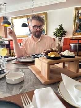 Millennial man enjoys a delicious dish in a stylish restaurant, emphasizing comfort and culinary delight. Elegant atmosphere combines modern decor with gastronomic pleasure. Meat food photo