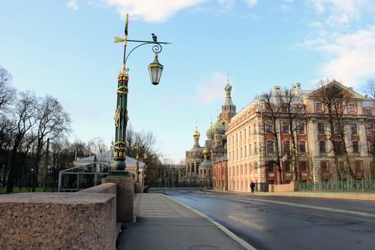 Urban cityscape of St. Petersburg featuring the ornate architecture of the Church of the Savior on Spilled Blood and surrounding historical buildings on a bright day. photo