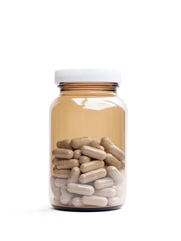 Green Medication Pharma Vitamins medicine Healthcare Capsules in a bottle photo
