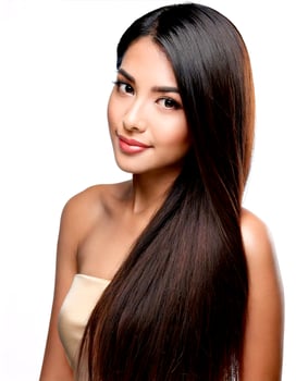 A beautiful young woman with long, straight hair photo