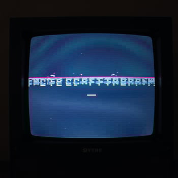 Glitched TV screen showcases pixelated background and distorted error broadcast complete with widespeed rewind effects photo