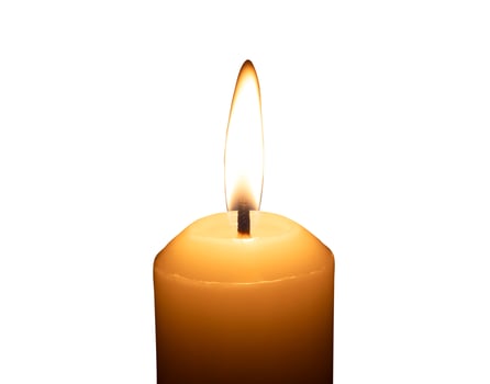 A single burning candle flame or light glowing on a big white candle isolated on white background with clipping path photo