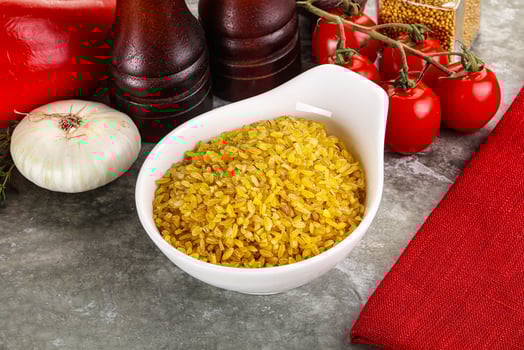 Dry wheat bulgur cereal heap photo
