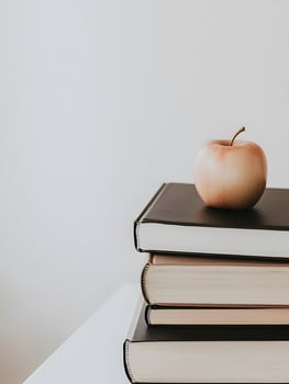 Some educating books with an apple on it reading education literature photo