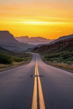 Scenic highway winding through mountains at sunset with vibrant sky and soft shadows photo