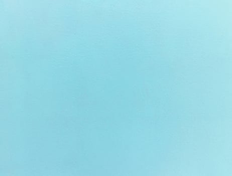 Minimalist light blue textured background with a subtle grain, ideal for design projects or as a backdrop. photo
