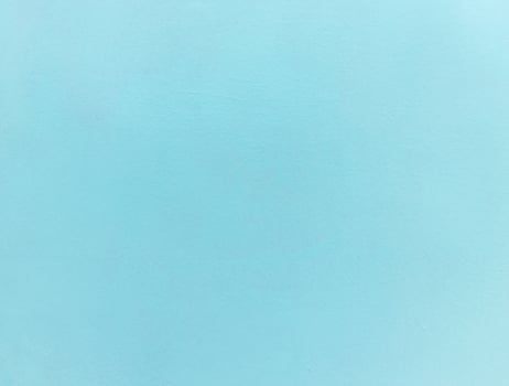 Minimalist light blue textured background with a subtle grain, ideal for design projects or as a backdrop. photo
