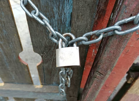 padlock used to lock a fence photo
