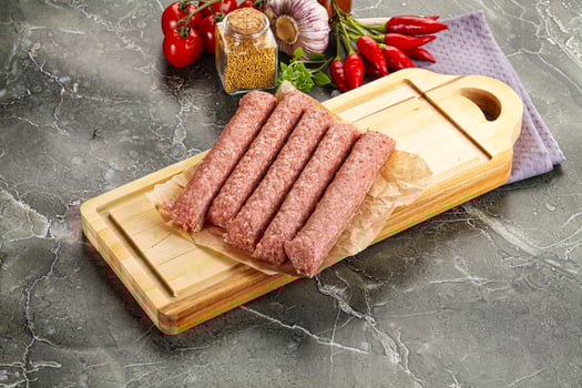 Raw beef kebab sausage for grill photo