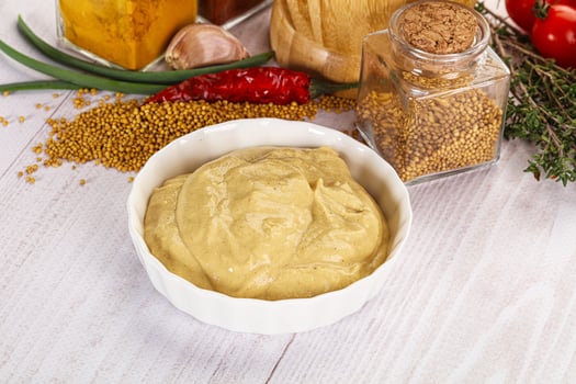 Dijon mustard sauce in the bowl photo