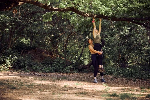 Mother And Daughter Having Fun While Hiking In The Forest photo